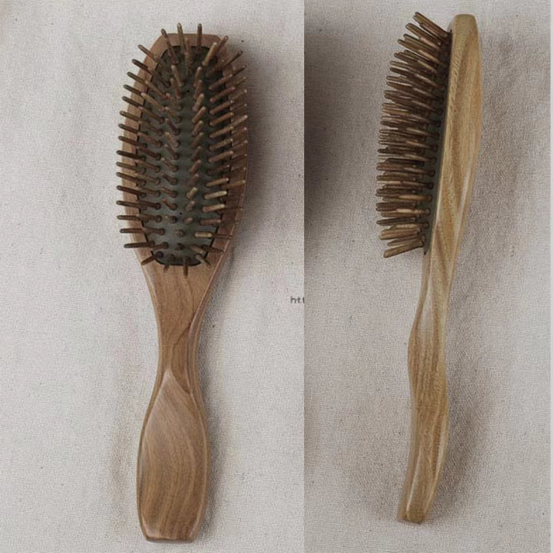 Hand-finished natural sandalwood comb with smooth wooden texture